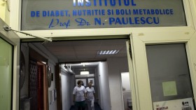 Staff from the Nicolae Paulescu National Institute for Diabetes, Nutrition and Metabolic Diseases in Bucharest walk along a corridor in Bucharest, November 13, 2012