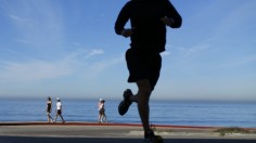 People walk and jog at Torrey Pines State Park in San Diego, California, November 14, 2012