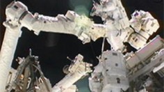 Spacewalkers Sunita Williams and Akihiko Hoshide work outside the International Space Station. 