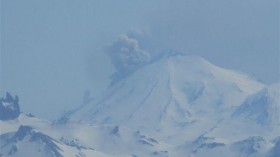 View of Pavlof's plume, about noon on May 14, 2013 Photograph taken from Cold Bay, which lies about 36 miles south of Pavlof.