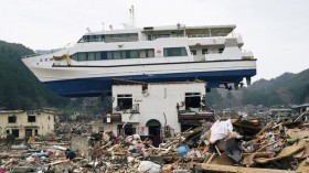 n Akahama, Japan, a boat dragged in from the 2011 tsunami sits atop a home. 