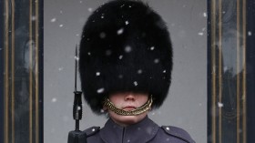 A Scots Guard stands to attention outside Buckingham Palace during a snow flurry in central London April 4, 2013