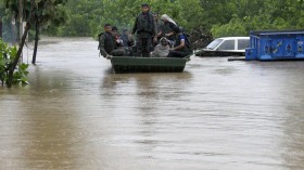 Indian army soldiers rescue stranded villagers in a boat after floods triggered by heavy rains at Odhri village in Yamunanagar district of the northern Indian state of Haryana June 17, 2013