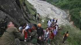 Soldiers rescue stranded people after heavy rains in the Himalayan state of Uttarakhand June 18, 2013