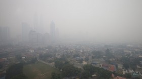 Malaysia's capital of Kuala Lumpur is seen covered with haze June 23, 2013. Malaysia declared a state of emergency in two parts of the southern state of Johor on Sunday 