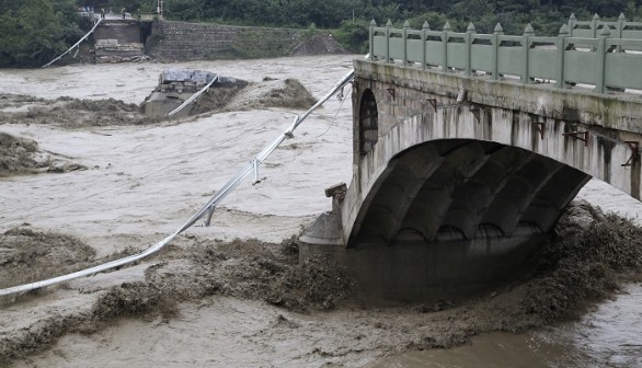 A bridge is collapsed after being hit by sweeping floods in Jiangyou, Sichuan province, July 9, 2013