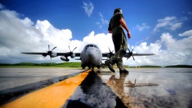 An Air Force pilot performs a pre-flight inspection of a 