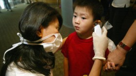 Singapore Residents Take Protective Measures Against SARS Virus