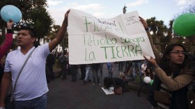 Demonstrators shout slogans during a rally calling for the government to keep the Yasuni initiative in place, outside Carondelet Palace in Quito August 15, 2013.