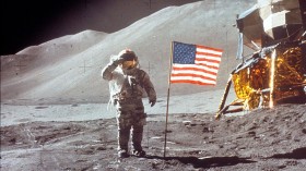 Astronaut David Scott Salutes by U.S. Flag