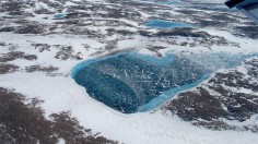 Frozen meltwater lake along the northeast Greenland coast