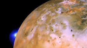 Images from the Voyager 1 probe taken decades ago make up this composite picture of Io which shows a plume spewing from a hotspot called Loki and catching the light on the horizon 