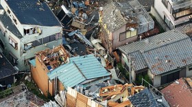 An aerial view shows damaged houses caused by what seemed to be a tornado in Koshigaya, north of Tokyo, in this photo taken by Kyodo September 2, 2013