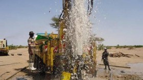 Water gushing out of a borehole at Napuu area during the flushing process.