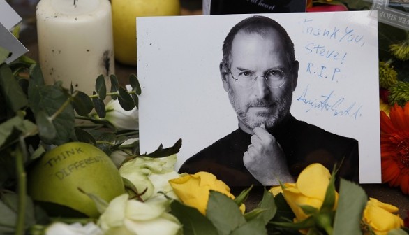 Tributes to the late Steve Jobs are left outside the Apple Store in London October 6, 2011