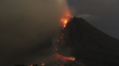 Mount Sinabung volcano spews ash and lava as seen from Erajaya village in Karo district, Indonesia's North Sumatra province, early morning January 6, 2014. 