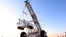 (WASP) payload suspended from a crane during an earlier test deployment.