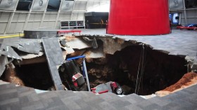 A sinkhole collapsed beneath the National Corvette Museum in Bowling Green, Ky. early Wednesday, taking eight valuable automobiles with it. 