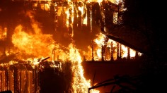 A structure burns during the Kincade fire in Geyserville, California