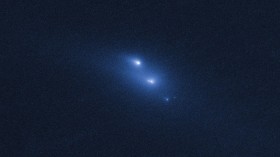 Disintegrating asteroid P/2013 R3 as viewed by Hubble on 29 October 2013.