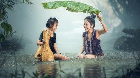 woman ang child in the rain