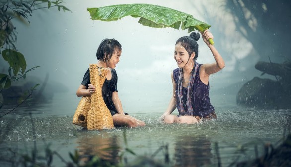 woman ang child in the rain