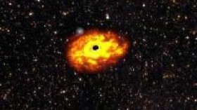 N ARTIST'S IMPRESSION OF THE EJECTION MECHANISM OF A STAR BY A SUPERMASSIVE BLACK HOLE.