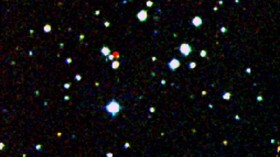 A nearby star stands out in red in this image from the Second Generation Digitized Sky Survey.