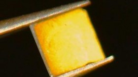 The first thin films of spin ice. The orange colouration is a spin ice film of only a few billionths of a meter thickness.