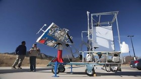 CU-Boulder postdoctoral researcher Tesfayohanes Yakob, left, and research engineer Dana Haushulz are shown here with a novel solar-thermal toilet developed by a team led by CU-Boulder Professor Karl Linden