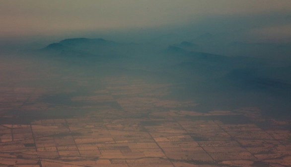 Smoke and haze over mountains are seen from a No 11 Squadron P-8A Poseidon conducting damage assessment and surveillance in the bushfire-affected area near Cooma