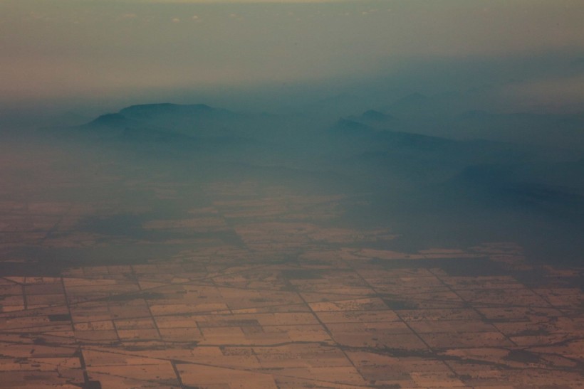 Smoke and haze over mountains are seen from a No 11 Squadron P-8A Poseidon conducting damage assessment and surveillance in the bushfire-affected area near Cooma