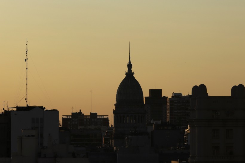 Congress building is silhouetted during sunset as smoke from Australia's raging bushfires affect the environment in Buenos Aires