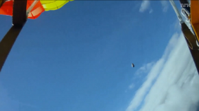 A skydiver is lucky to be alive after what appears to be a meteorite nearly struck him during free fall. 