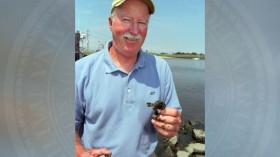 Charles Epifanio holding native mud crabs