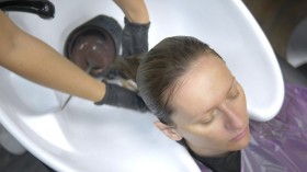 Process of washing your hair in a hairdresser. girl in a beauty salon.