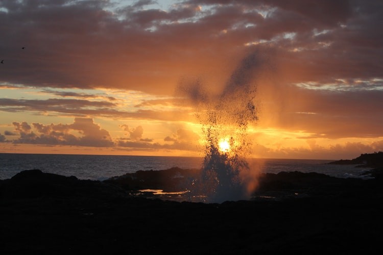 Spouting Horn blow hole at sunset.