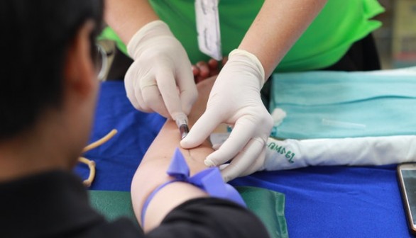 A Man about to get his blood tested before receiving covid-19 vaccine