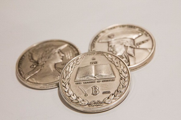  Silver coins with the Bitcoin logo 