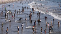 People Cooling off at the beach due to the heat wave