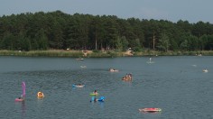 People Cooling off in the lake due to the hot temperature