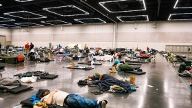 Portland residents resting at a convention cooling center due to the heat wave