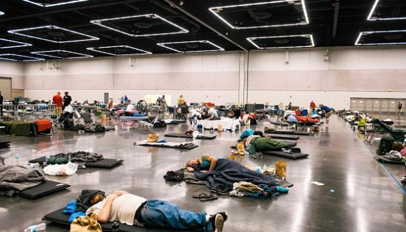 Portland residents resting at a convention cooling center due to the heat wave