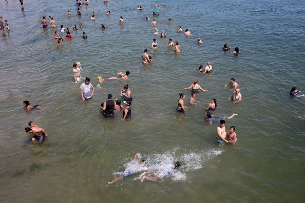 People Cooling off due to the heat wave in New York city