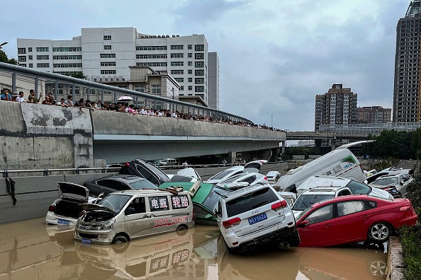 Cars trapped in floodwaters after heavy rains hit the city of Zhengzhou 
