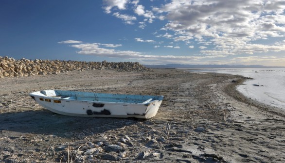 White and Blue Boat on Brown Sand