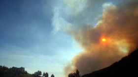 Smoke from a brush fire covers the sun in  California