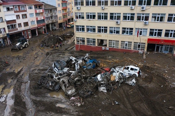 Damaged buildings and destroyed vehicles after flash floods destroyed parts of Bozkurt town
