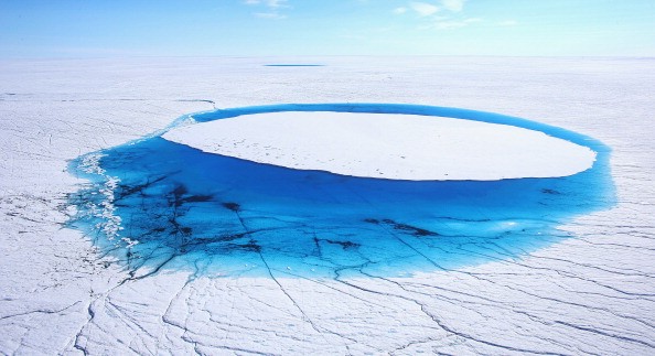 Water is seen on part of the glacial ice sheet, Greenland