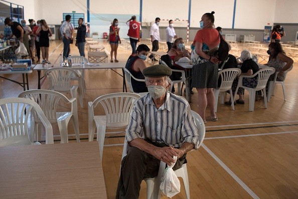 A man from a neighbouring town at a sports center in Ronda after he was evacuated from his home because of the fire